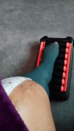 Person using the SHUFFLER® for gentle seated movement